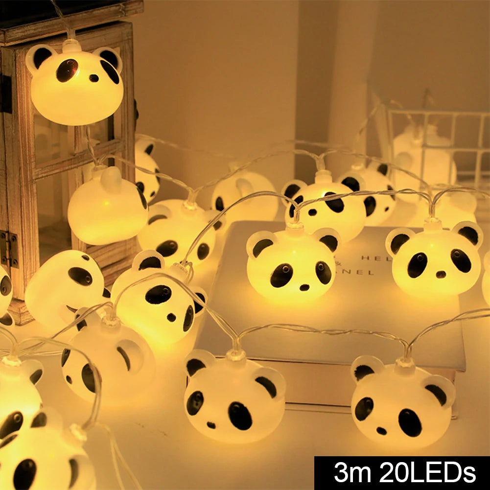 veilleuse tête de panda dans un bureau