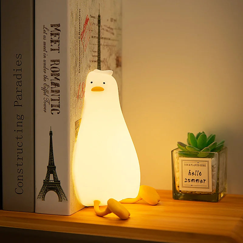 veilleuse musicale bébé pingouin dans une chambre 
